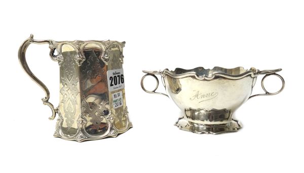 Silver, comprising; a Victorian christening mug, of tapered octagonal form, with Gothic inspired decoration and with a scrolling handle, London 1854 a