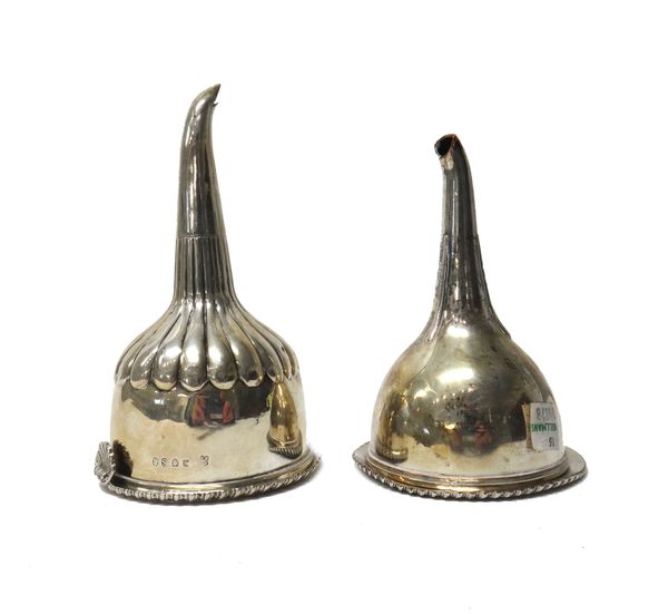 A George III silver wine funnel, with partly fluted decoration, the detachable top with a gadrooned rim and with a scalloped thumbpiece, by Eames & Ba