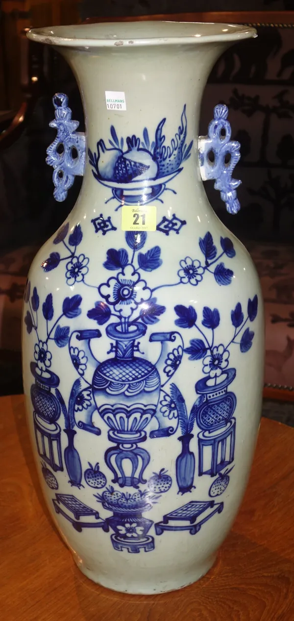 A Chinese large blue and white celadon vase, late 19th century, of ovoid form with trumpet neck, painted with vases of fruit and flowers, pierced hand
