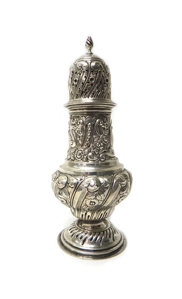 A silver baluster shaped sugar caster, with floral and scroll embossed decoration, on a circular foot, height 20.5cm, Chester 1907, gross weight 175 g