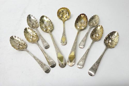 A group of silver gilt, later embossed and engraved dessert table flatware, comprising; a set of six dessert spoons, London 1816, a pair of tablespoon