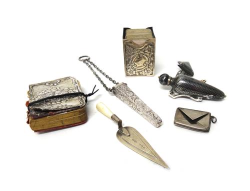 A Victorian silver case, of rectangular form, holding two packs of small playing cards, the exterior with floral embossed decoration, Birmingham 1899,