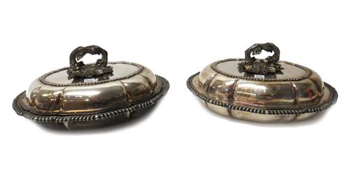 Two pairs of Austrian servers, eleven table knives, with steel blades, the loaded German handles detailed 800, nine cheese knives, with steel blades,