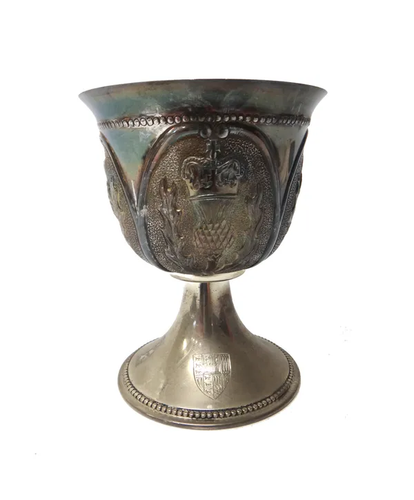 A Scottish silver goblet, the body having four panels decorated with thistles, raised on a trumpet shaped base, engraved with a shield and having bead