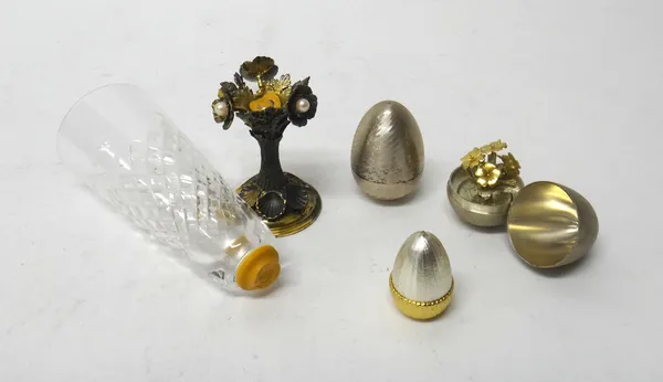 Silver and silver mounted wares, comprising; a parcel gilt model of an acorn, opening to reveal two squirrels, a parcel gilt egg, opening to reveal a
