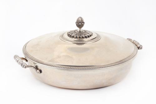 A European twin handled lidded tureen and cover, of circular form, with cast handles, the detachable cover with a bud finial and with decorated border