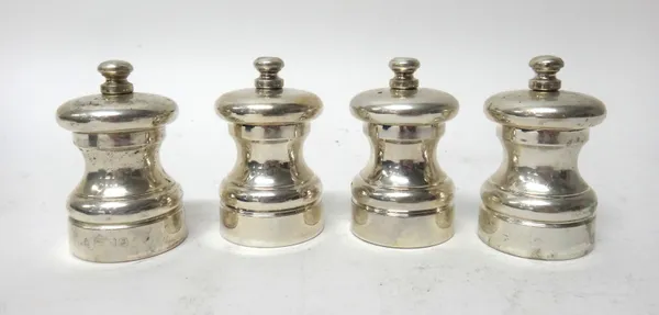 Four silver capstand shaped peppermills, detailed 'Peter Piper' peppermill, height 7cm, each with a box, (4).