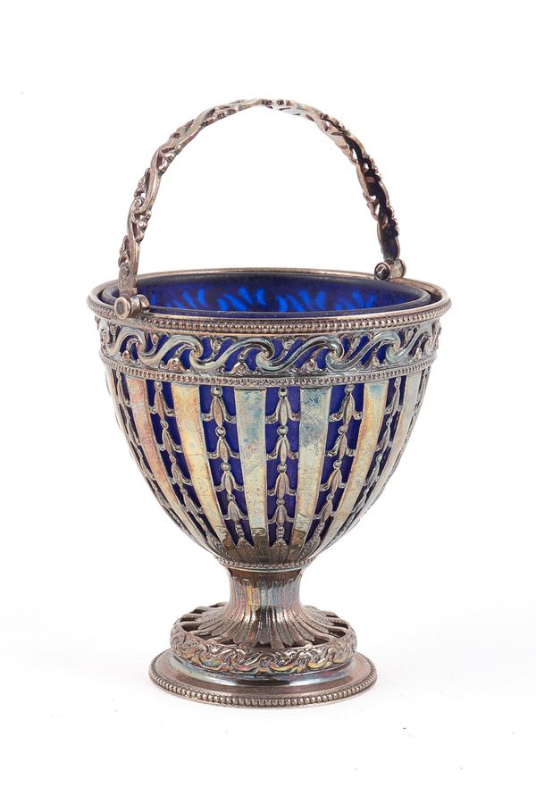 A George III silver sugar basket, with pierced decoration to the body within a  scroll pierced border and with beaded rims, with a scroll pierced swin