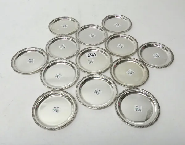 Thirteen Italian circular coasters, each with similarly decorated rims, diameter 10.5cm, detailed 800, combined weight 743 gms, (13).