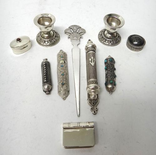 Foreign wares, comprising; a pair of miniature candlesticks, a pill box formed as a book, an oval pill box, a circular pill box, detailed 900, an Egyp