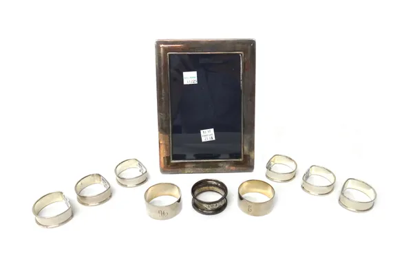 Silver and silver mounted wares, comprising; a rectangular plain photograph frame, a pair of plain napkin rings, a set of five napkin rings, another s