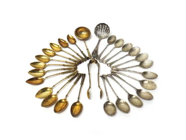 Twelve silver coffee spoons, having scallop shell shaped bowls and with twist motifs to the handles, a sugar sifting spoon, Sheffield 1898, a set of t