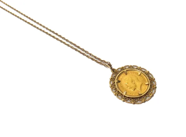 A George V half sovereign 1914, in a 9ct gold pendant mount, decorated with a scrolling border, with a multiple link neckchain, on a boltring clasp, c