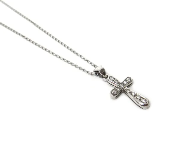 An 18ct white gold and diamond set pendant cross, mounted with circular cut diamonds, on an 18ct white gold oval link neckchain, with a boltring clasp