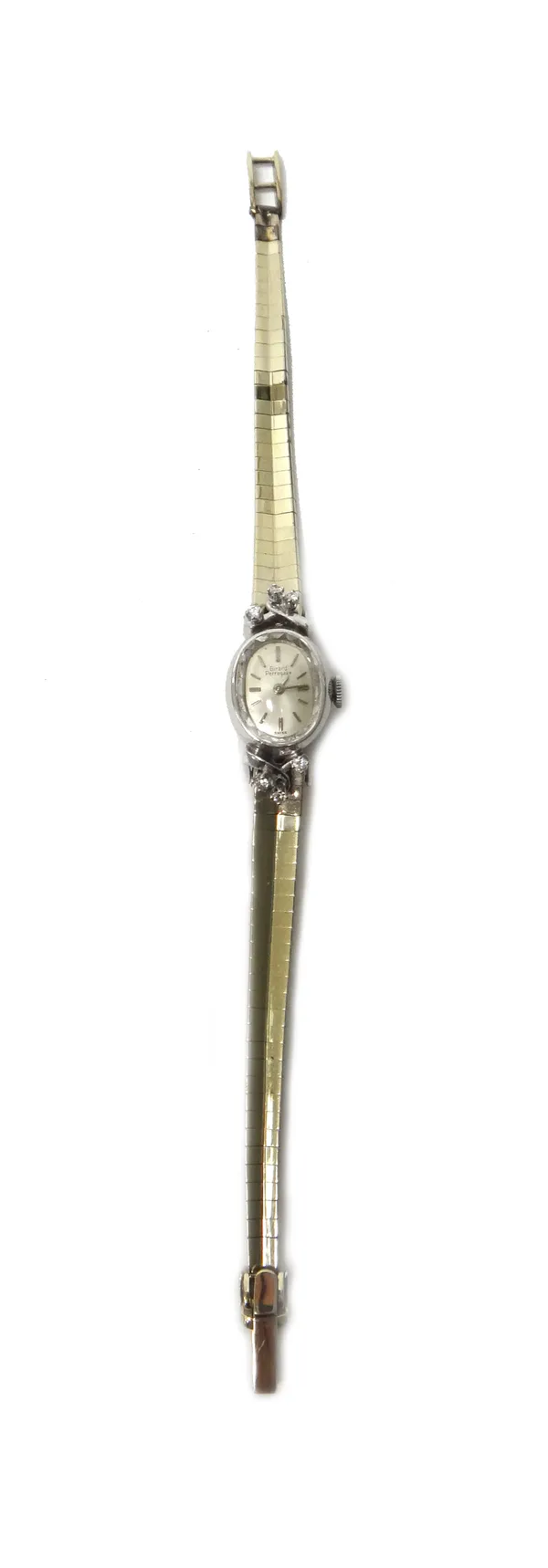 A Girard Perregaux white gold and diamond set oval cased lady's dress bracelet wristwatch, with a signed jewelled movement, the signed silvered dial w