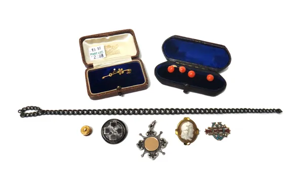 Four gold mounted coral dress studs, a silver curb link part of a watch chain, a silver fob medal, a gold, seed pearl and red gem set lace pin with a