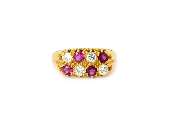 An 18ct gold, ruby and diamond ring, mounted with four circular cut diamonds, alternating with four circular cut rubies, in a two row design, ring siz