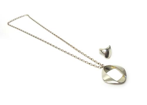 A Georg Jensen silver pendant, in an openwork shaped circular design, detailed Georg Jensen Denmark 925 S 368, import mark London 1968, with a silver