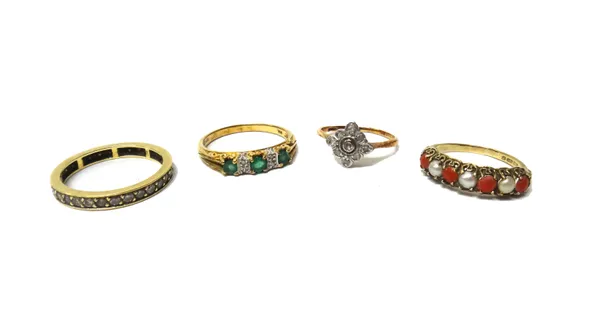 A 9ct gold, emerald and diamond ring, mounted with three circular cut emeralds and with two pairs of circular cut diamonds mounted at intervals, a gol