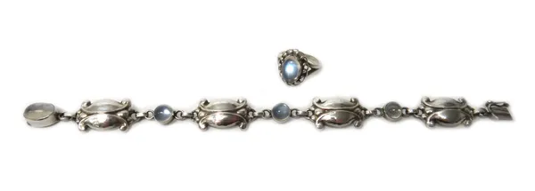 A Georg Jensen silver and moonstone bracelet, in a panel shape link design, collet set with oval cut moonstones at intervals, on a snap clasp, detaile