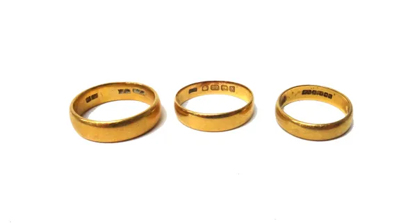 A 22ct gold plain wedding ring, Birmingham 1922 and two further 22ct gold plain wedding rings, combined weight 14.5 gms, (3).