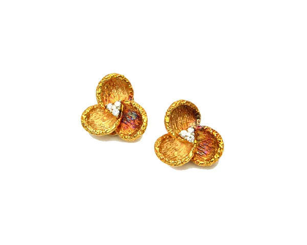 A pair of 18ct gold and diamond set earclips, each designed as a trefoil, mounted with three circular cut diamonds at the centre and otherwise having