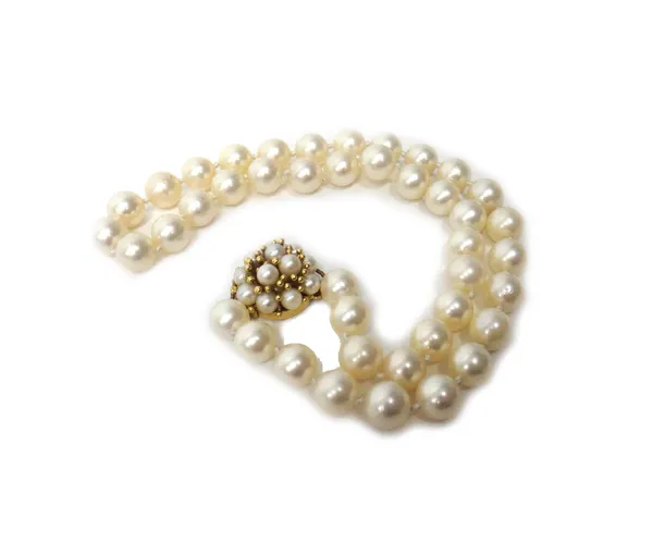 A single row necklace of forty-two cultured pearls, on a gold and cultured pearl cluster clasp and forty-six additional loose cultured pearls.