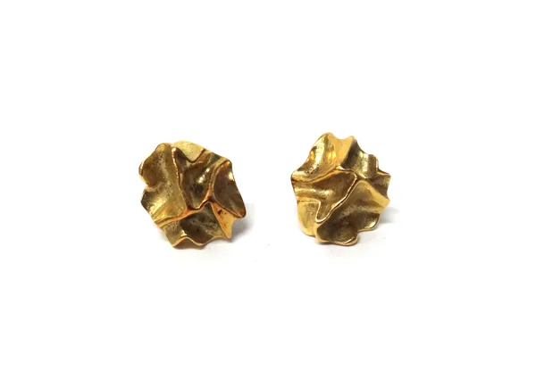 A pair of gold earstuds, each in a cast abstract design, gross weight 10.5 gms.