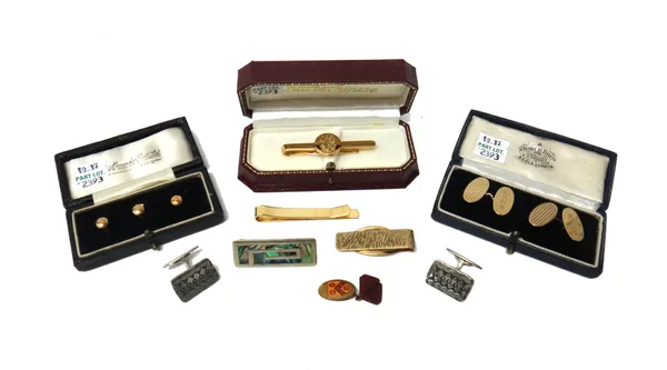 A pair of 9ct gold oval cufflinks, engine turned to one side and engraved with initials to the other side, a set of three 9ct gold studs, with a case,