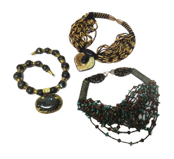 A labradorite bead necklace, the front with an oval labradorite pendant, by Eileen Coyne, a carved jade and ceramic multiple row necklace, the Orienta