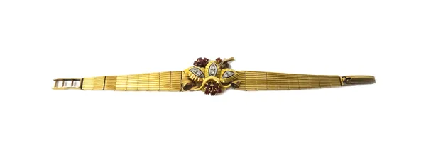 A lady's 9ct gold, ruby and diamond set Josarn cocktail bracelet wristwatch, the jewelled movement detailed Swiss Made, the signed silvered dial with