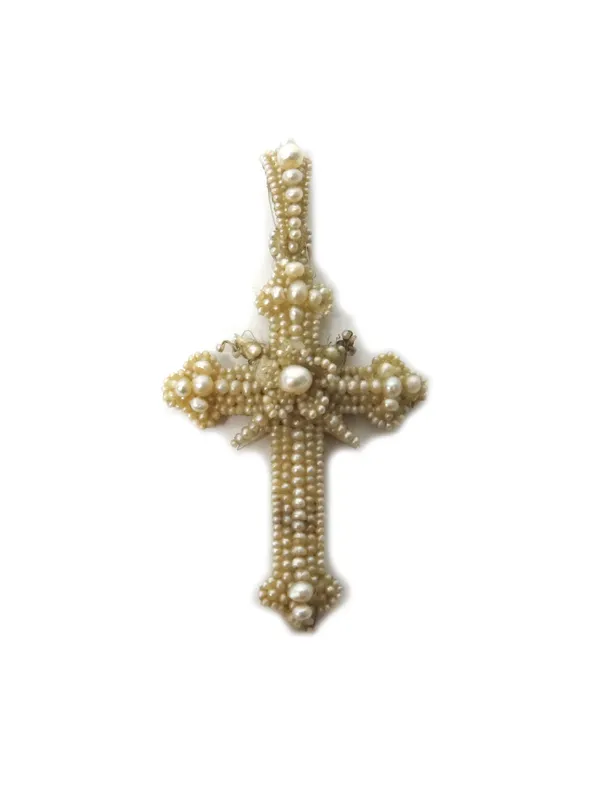 A seed pearl and mother-of-pearl set pendant cross, having a central flower head shaped motif, mid-19th century, with a later oval case.