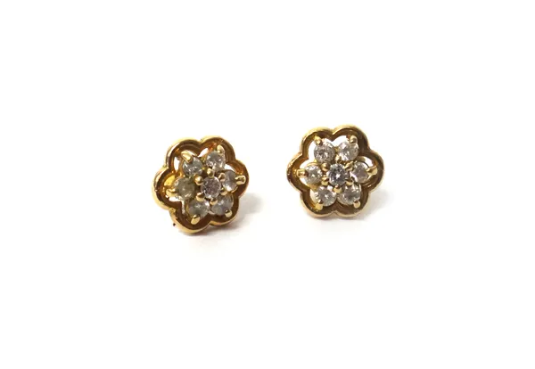 A pair of 9ct gold and diamond seven stone cluster earstuds, claw set with circular cut diamonds, the backs with post and butterfly clip fittings.