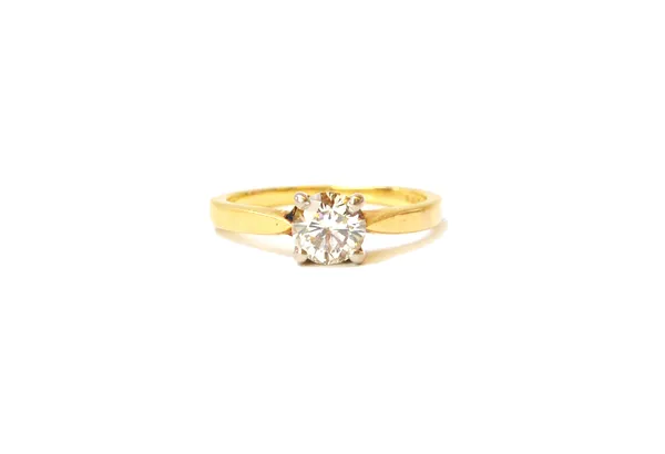 An 18ct gold and diamond single stone ring, claw set with a circular cut diamond, ring size approx I and a half, with a case.  Illustrated