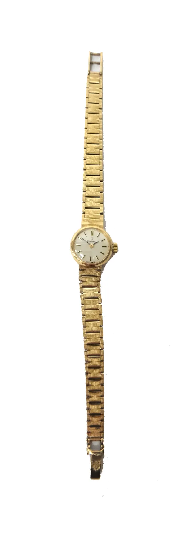 An Omega 9ct gold lady's bracelet wristwatch, the signed circular silvered dial with baton shaped numerals, on a tapering textured link bracelet, havi