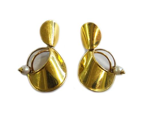 A pair of gold and cultured pearl earrings, with post and folding clip fittings, each formed as one small and one larger curved metal circular disc, t
