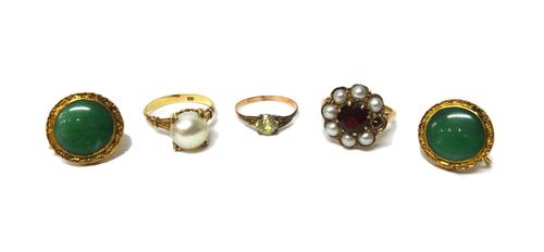 A gold, garnet and cultured pearl cluster ring (one cultured pearl lacking), a gold ring mounted with a cultured pearl, detailed K 14, a gold and pale
