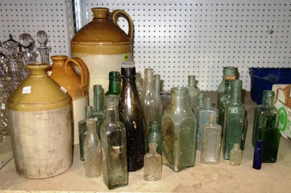 Collectables, including; mainly 20th century glass bottles of various shapes and sizes and a group of three stoneware flagons, (qty).  K4