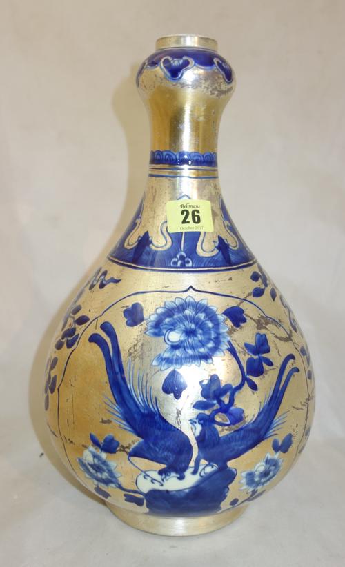 A Chinese 'clobbered' blue and white onion vase, 19th century, of pear form with onion neck, painted with pheasants and chrysanthemum on a ground of B