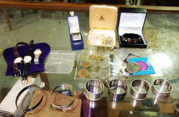 A small quantity of silver coins, jewellery, napkin rings and sundry, (qty).   CAB