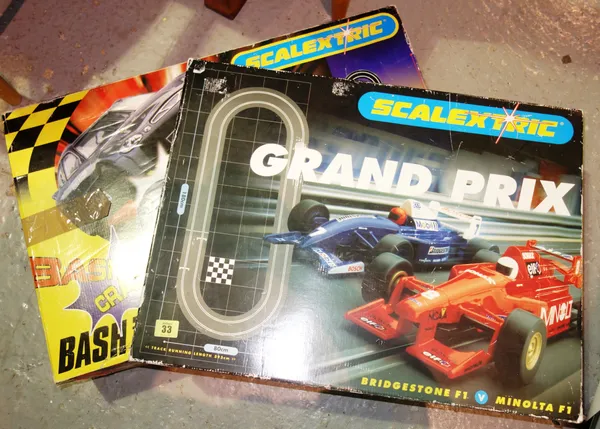 A Scalextric Grand Prix racing set, a Scalextric 'Crash & Bash' set and two accessory sets (4).  S3T
