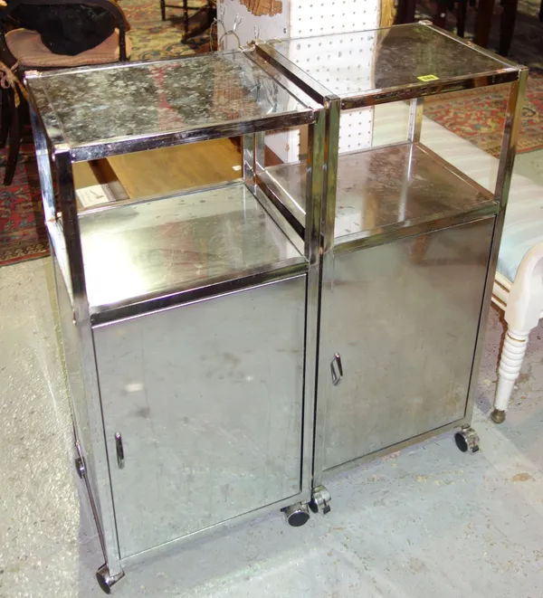 A pair of 20th century chrome bed side tables, with mirrored top, (2).  J5