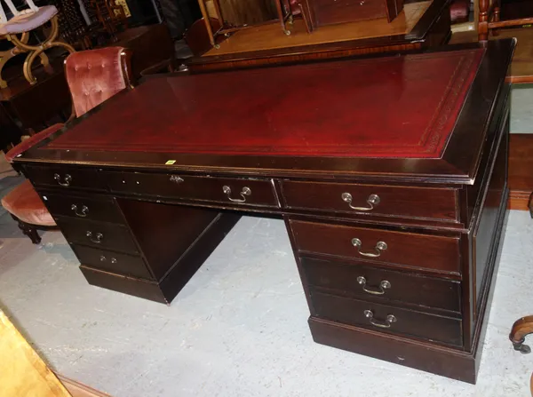 A 20th century mahogany pedestal desk, with red leather inset top, 182cm wide x 76cm high.  J7