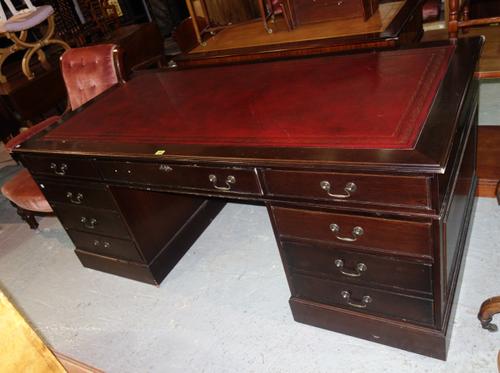 A 20th century mahogany pedestal desk, with red leather inset top, 182cm wide x 76cm high.  J7