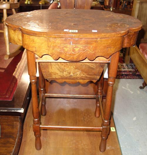A walnut inlaid lift top work table, 68cm wide x 61cm high.   J5