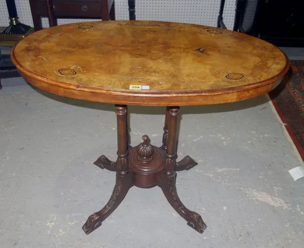 A Victorian walnut oval occasional table, with central column on hoof feet, 89cm wide x 70cm high.  I10