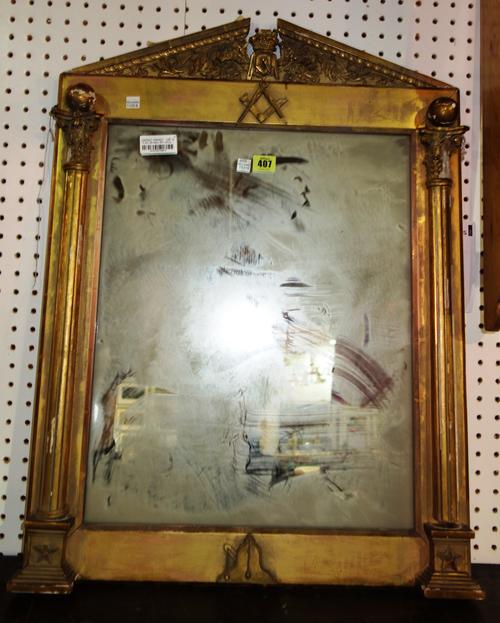 An early 20th century gilt framed wall mirror with Masonic crest, 56cm wide x 174cm high.   J6