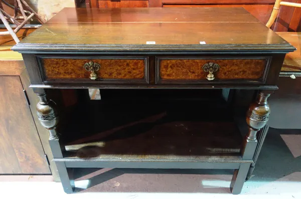 A 17th century style carved oak side table, with two drawers, 100cm wide x 88cm high.      F9