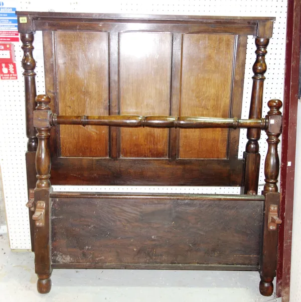A 20th century carved oak single bed.   A9