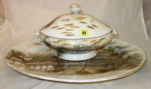 A Japanese porcelain part dinner service, 20th century, each piece painted with famous views of Japan, comprising; a tureen and cover, an oval dish (4